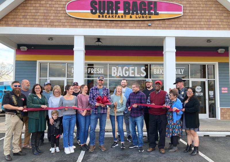 Surf Bagel Milford ribbon-cutting attendees shown are (l-r) Honorary Mayor Justin Walker, Surf Bagel Administrative Director D.J. Forcucci, CCGM President Angel Hodges, Surf Bagel Milford Manager Guillermo Montalvo, CCGM Treasurer Debbie Millman, Maddox Deeney, Surf Bagel Marketing Manager Katie Frederick, Surf Bagel Director of Operations Dan Wheeler, Surf Bagel Milford Manager Bryn Davis, Surf Bagel Vice President Matt Patton, Surf Bagel Milford General Manager Taylor Quillen, Highwater Management Vice President Dan Levin, Surf Bagel Director of Operations Wes Books, Surf Bagel Corporate Chef Joe Charles, Milford Mayor Archie Campbell, CCGM Vice President Alicia Hollis, Milford Police Department Acting Chief Edward Huey and CCGM Secretary Joie Morgan. SUBMITTED PHOTO